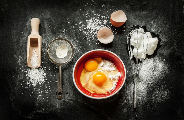 Nafplion Cooking Class Tour: bowl filled with flour and eggs resting on a black cooking counter