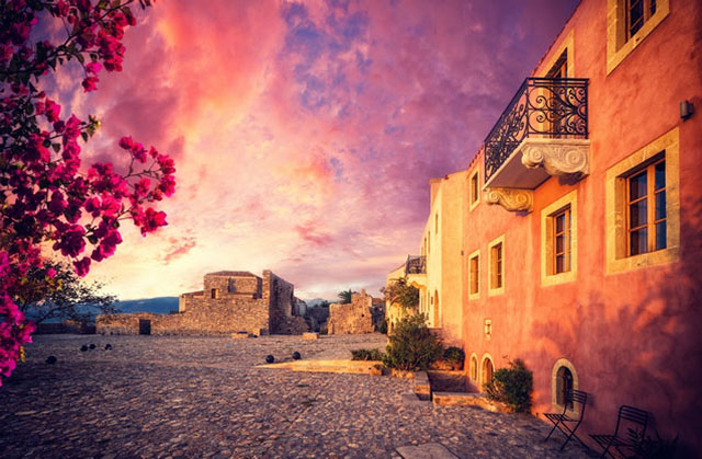 Nafplion Monemvasia Castle Tour: buildings illuminated by the sunshine at sunset in Monemvasia