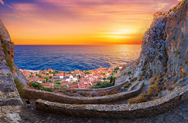 Multi Day Tours: the view of the sea at sunset over the castles of Monemvasia