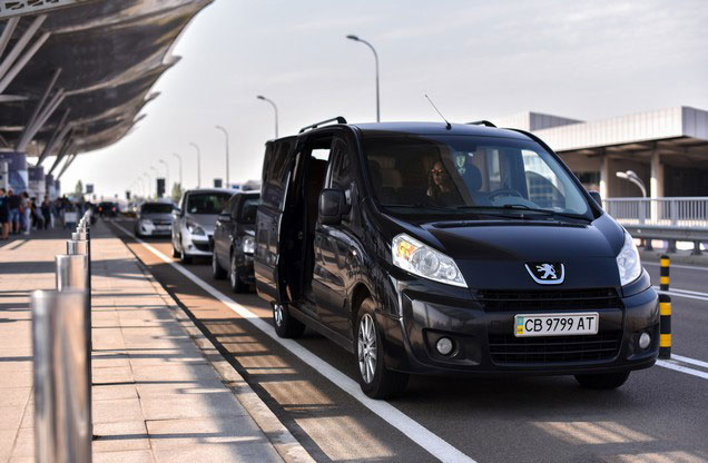 Athens Airport El.Venizelos to or from Ermioni, Portoheli or Costa: black luxury van parked outside the airport