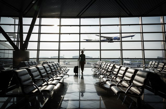 Athens Airport El.Venizelos to or from Kalamata: a man looks at the planes flying out of the airport window