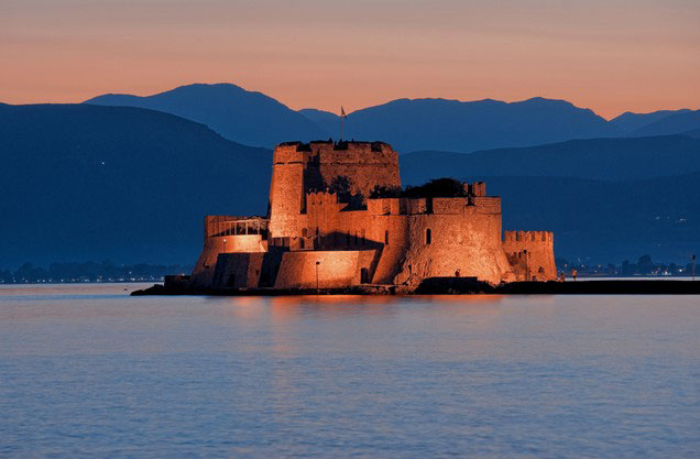 Nafplion to Monemvasia and return: Bourtzi illuminated at night in Nafplio