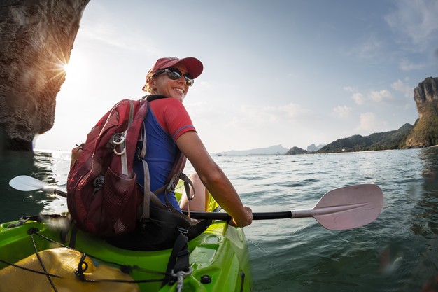 a woman kayaking in the bay of Navarino