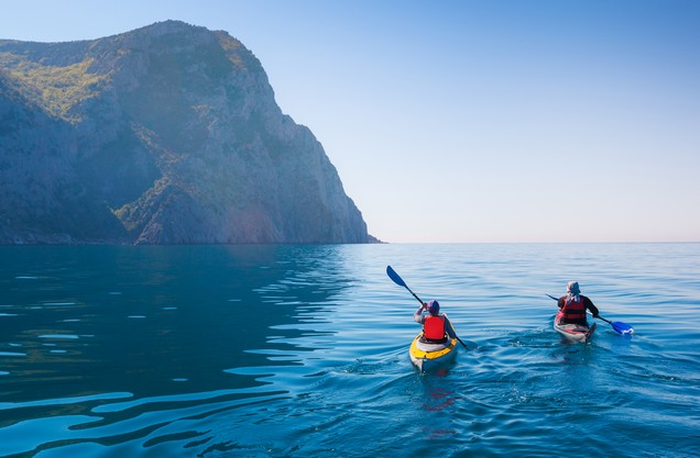 two people do sea kayaking in the bay of Navarino