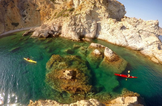 Remote Islands Kayak Tour: canoeing in the blue-green waters of Tolo beach